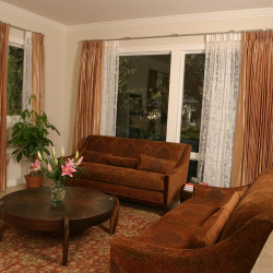 Custom Reupholstery with Matching Custom Drapes in Living Room