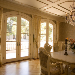 Embroidered Sheer Drapes on Wrought Iron Curtain Rod in Formal Dining Room