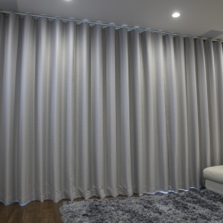 Somfy Glydea Motorized Curtain Rod with Ripplefold Drapes in Living Room