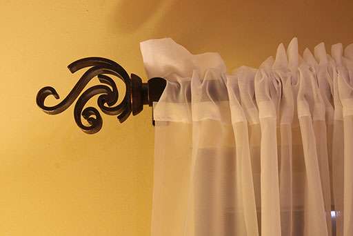 a curtain is hanging on the side of a window