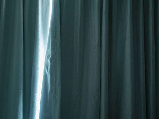 a curtain with a light coming through it