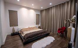Motorized Back Slat Custom Roman Shades in Master Bedroom