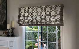 residential living room floral pattern soft fold roman shade open